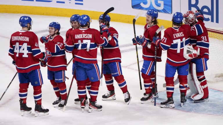 Members of the Montreal Canadiens celebrate their victory over the Florida Panthers following the last game of their NHL season in Montreal on Friday, April 29, 2022. (Paul Chiasson/CP)