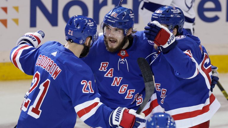 New York Rangers defenseman Ryan Lindgren (55) celebrates with teammates after scoring a goal against the Tampa Bay Lightning during the second period in Game 5 of the NHL Hockey Stanley Cup playoffs Eastern Conference Finals, Thursday, June 9, 2022, in New York (AP Photo/Adam Hunger)