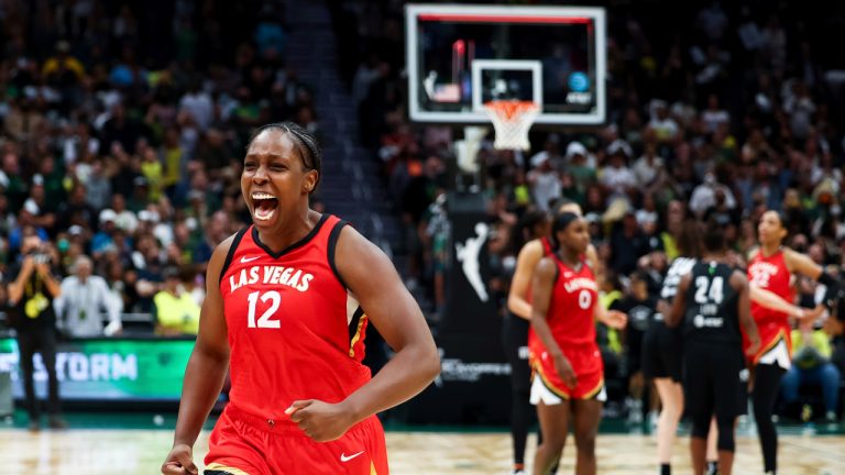 Las Vegas Aces guard Chelsea Gray (12) reacts at the end of the team's win over the Seattle Storm in Game 4 of a WNBA basketball playoff semifinal Tuesday, Sept. 6, 2022, in Seattle. (AP Photo/Lindsey Wasson)