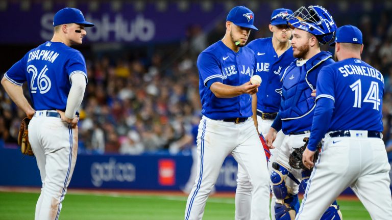 Toronto Blue Jays starting pitcher Jose Berrios (17) is taken out of the game by interim manager John Schneider (14) during sixth inning MLB baseball action against the New York Yankees, in Toronto on Tuesday, September 27, 2022. THE CANADIAN PRESS/Christopher Katsarov