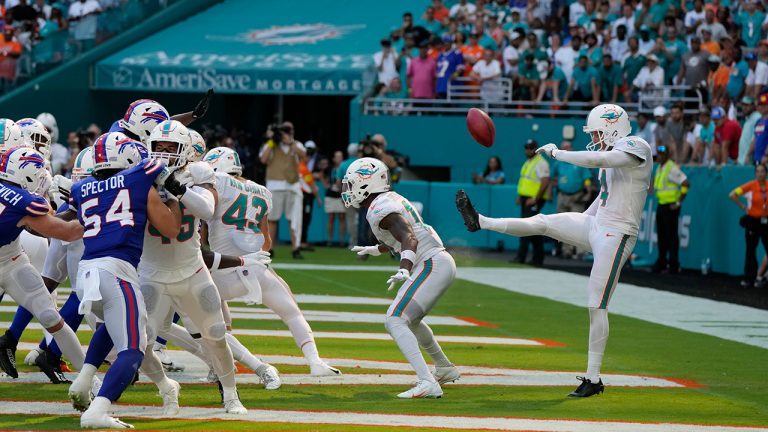 Miami Dolphins punter Thomas Morstead (4) sees the ball go backwards after attempting a punt during the second half of an NFL football game against the Buffalo Bills, Sunday, Sept. 25, 2022, in Miami Gardens, Fla. The play resulted in a safety for the Buffalo Bills. (Rebecca Blackwell/AP)