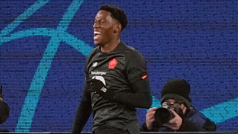 Lille's Jonathan David celebrates after scoring his side's second goal during the Champions League group G soccer match between VfL Wolfsburg and Lille OSC in Wolfsburg, Germany, Wednesday, Dec. 8, 2021. (Martin Meissner/AP)