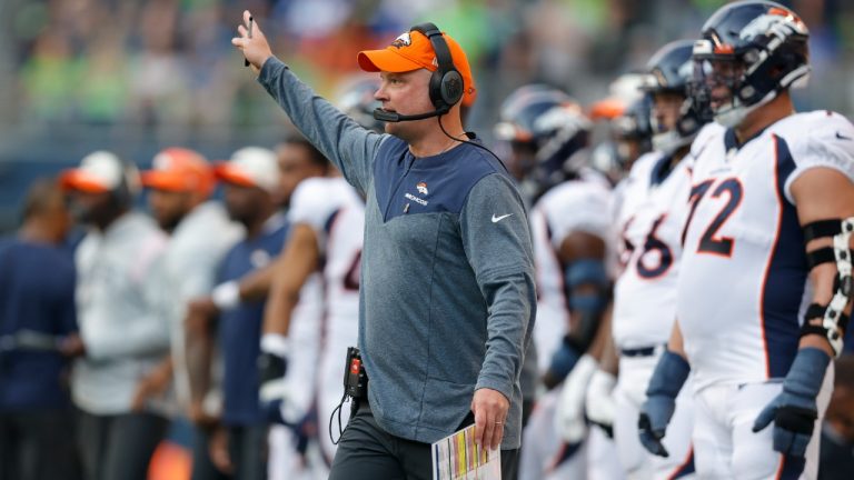 Denver Broncos head coach Nathaniel Hackett signals from the sideline during the first half of an NFL football game against the Seattle Seahawks, Monday, Sept. 12, 2022, in Seattle. (John Froschauer/AP)