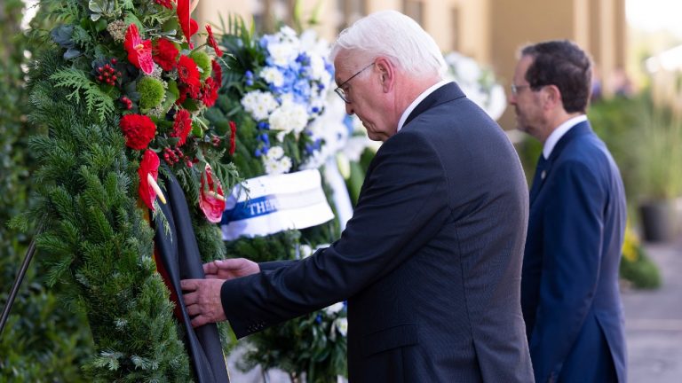 German President Frank-Walter Steinmeier, left, and Israeli President Isaac Herzog, right, attend a wreath laying ceremony to commemorate the victims of the attack by Palestinian militants on the 1972 Munich Olympics in Fuerstenfeldbruck near Munich, Germany, Monday, Sept. 5, 2022. (Sven Hoppe/dpa via AP)