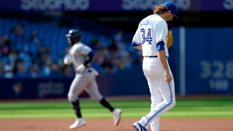 Toronto Blue Jays starting pitcher Kevin Gausman (34) hangs his head as Tampa Bay Rays’ Yandy Diaz rounds the bases on his three run home-run during second inning MLB baseball action in Toronto, Thursday, Sept. 15, 2022. (Frank Gunn/CP)