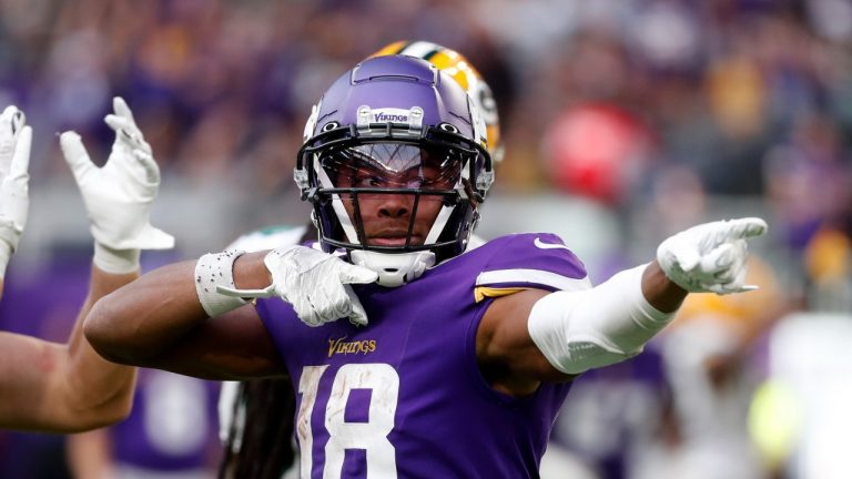 Minnesota Vikings wide receiver Justin Jefferson (18) celebrates after catching a pass for a first down during the second half of an NFL football game against the Green Bay Packers, Sunday, Sept. 11, 2022, in Minneapolis. (Bruce Kluckhohn/AP Photo)