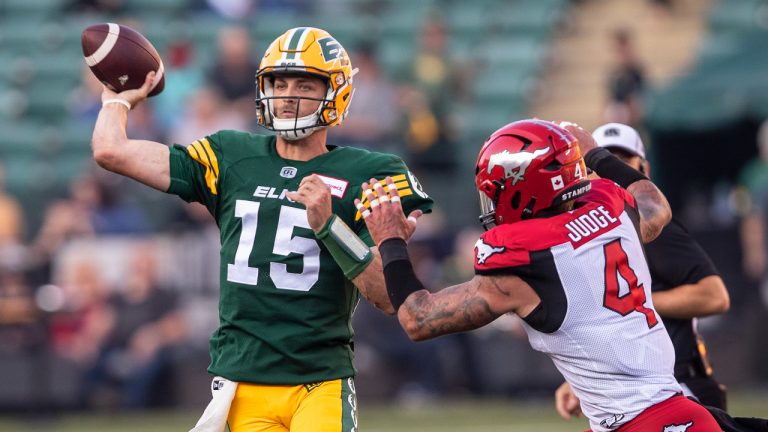 Calgary Stampeders' Cameron Judge (4) chases Edmonton Elks quarterback Taylor Cornelius (15) as he makes the throw during first half CFL action in Edmonton, Alta., on Saturday September 10, 2022. (Jason Franson/CP)