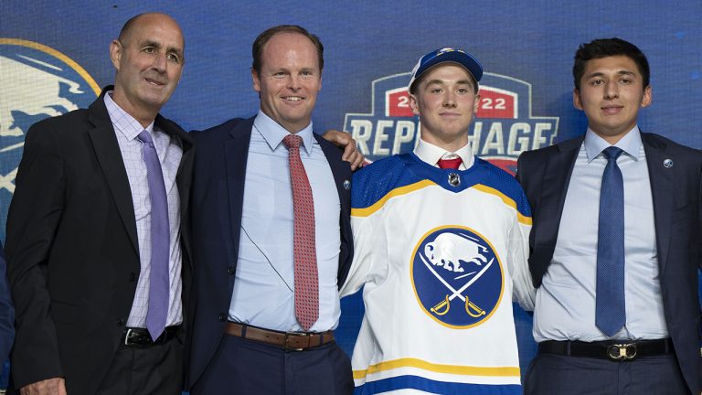 Buffalo Sabres 16th pick Noah Ostlund poses with team officials during the first round of the 2022 NHL Draft   Thursday, July 7, 2022 in Montreal. (Ryan Remiorz/CP)