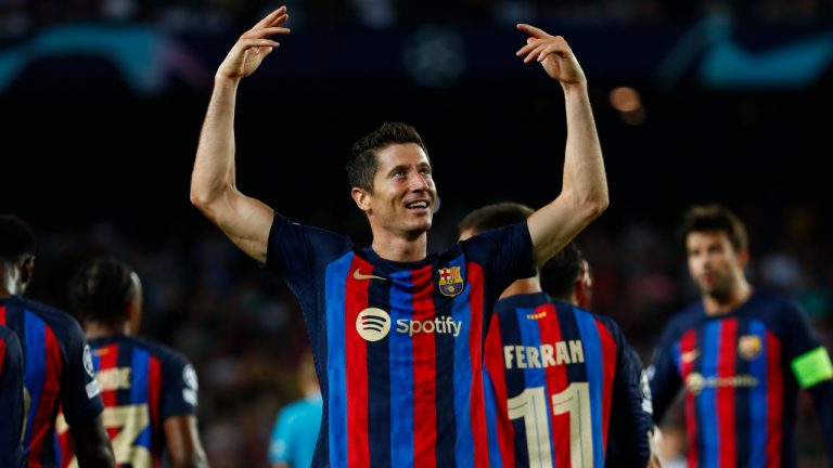 Barcelona's Robert Lewandowski celebrates after scoring his side's fourth goal during a Group C Champions League soccer match between FC Barcelona and Viktoria Plzen. (Joan Monfort/AP)