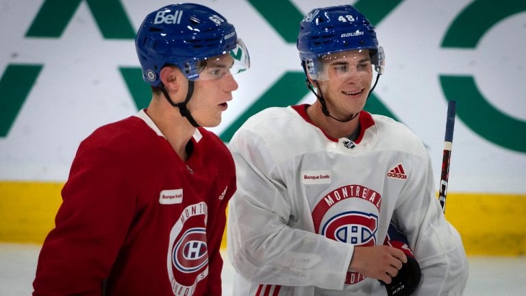 Montreal Canadiens top draft picks Juraj Slafkovsky, left, and Filip Mesar, both from Slovakia, take a break after skating drills at the Bell Sports Complex in Brossard, Que., during day one of their evaluation camp on Monday, July 11, 2022. (Peter McCabe/CP)