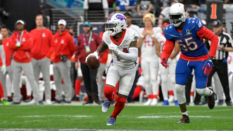 AFC wide receiver Stefon Diggs (14), of the Buffalo Bills, runs with the ball as NFC outside linebacker Chandler Jones (55), of the Arizona Cardinals, moves in during the first half of the Pro Bowl NFL football game, Sunday, Feb. 6, 2022, in Las Vegas. (David Becker/AP)