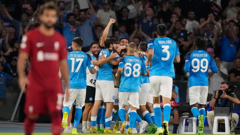 Napoli's team players celebrate after Piotr Zielinski scored their side's fourth goal during the group A Champions League soccer match between Napoli and Liverpool at the Diego Armando Maradona stadium in Naples, Italy. (Andrew Medichini/AP)