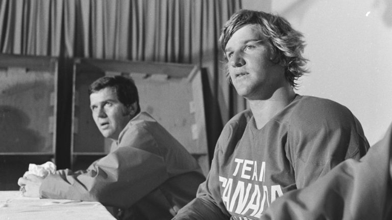 Bobby Orr (right), Team Canada coach Harry Sinden (left) and assistant coach John Ferguson Sr. (not pictured) take part in a press conference ahead of the 1972 Summit Series against the U.S.S.R. (Andy Clark/CP)