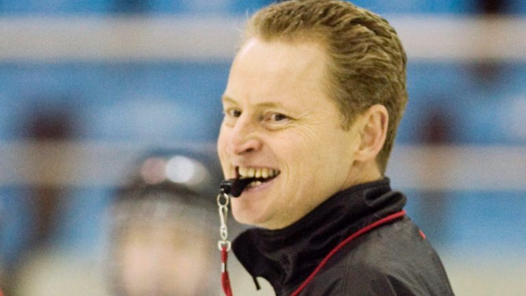 Team Canada head coach Peter Smith keeps an eye on the action during practice at the Women's World Hockey Championships in Harbin, China on Monday April 7, 2008. (Frank Gunn/CP)