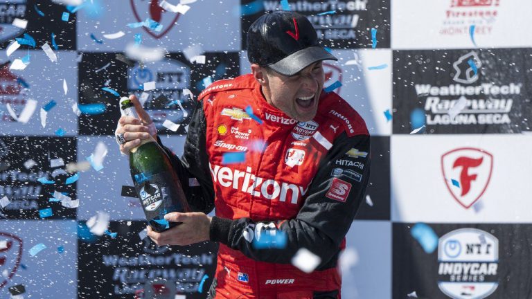 Team Penske driver Will Power, of Australia, celebrates after winning third place in the IndyCar season finale auto race at Laguna Seca Raceway on Sunday, Sept. 11, 2022, Monterey, Calif. Power also won the 2022 championship.(Nic Coury/AP)