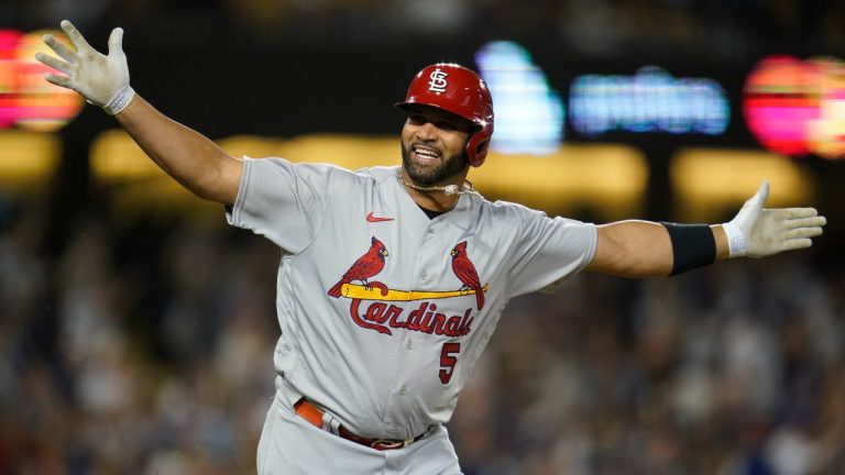 St. Louis Cardinals designated hitter Albert Pujols (5) reacts after hitting a home run during the fourth inning of a baseball game against the Los Angeles Dodgers in Los Angeles, Friday, Sept. 23, 2022. Brendan Donovan and Tommy Edman also scored. It was Pujols' 700th career home run. (Ashley Landis/AP Photo)