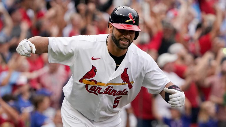 St. Louis Cardinals' Albert Pujols celebrates after hitting a two-run home run during the eighth inning of a baseball game against the Chicago Cubs Sunday, Sept. 4, 2022, in St. Louis. (Jeff Roberson/AP Photo)