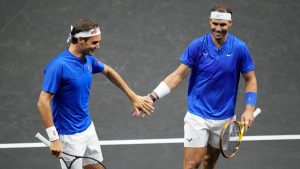 Team Europe's Roger Federer, left, and Rafael Nadal react during their Laver Cup doubles match against Team World's Jack Sock and Frances Tiafoe at the O2 arena in London, Friday, Sept. 23, 2022. (Kin Cheung/AP)