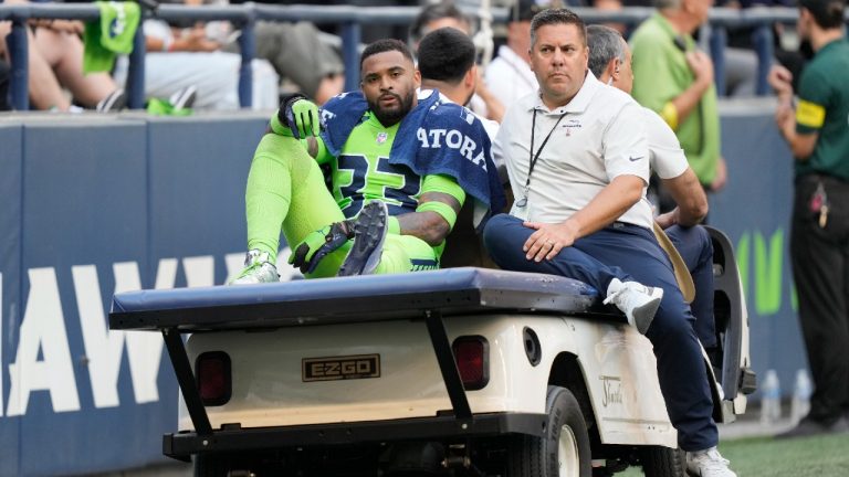 Seattle Seahawks safety Jamal Adams is taken off the field on a cart after an injury during the first half of an NFL football game against the Denver Broncos, Monday, Sept. 12, 2022, in Seattle. (Stephen Brashear/AP)