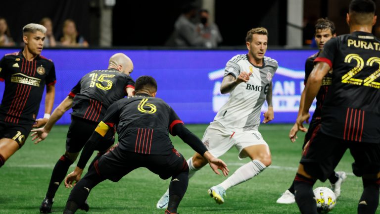 Toronto FC forward Federico Bernardeschi (10), third from right, drives through Atlanta United defenders in the box, drawing a penalty in the box which was overturned on review, during the first half of an MLS soccer match Saturday, Sept. 10, 2022, in Atlanta. (Bob Andres/AP)