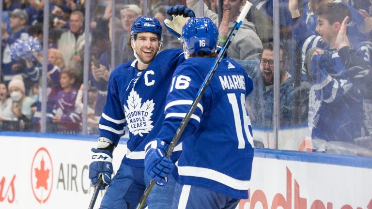 Toronto Maple Leafs captain John Tavares (91) celebrates with teammate Mitchell Marner after scoring a goal against the Florida Panthers. (Chris Young/CP)