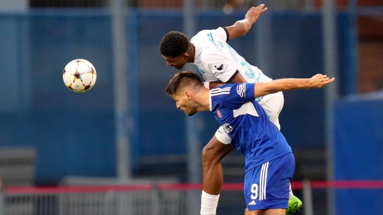 Chelsea's Wesley Fofana, top, jumps for a header with Dinamo's Bruno Petkovic during the Champions League group E soccer match between Dinamo Zagreb and Chelsea at the Maksimir stadium in Zagreb, Croatia, Tuesday, Sept. 6, 2022. (Darko Bandic/AP)