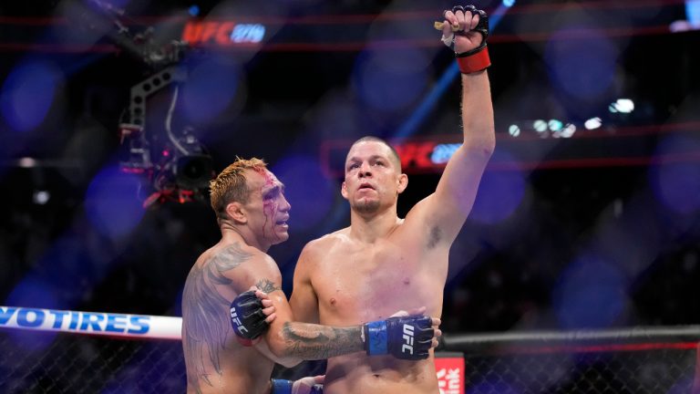 Nate Diaz, right, celebrates after defeating Tony Ferguson in a welterweight bout during the UFC 279 mixed martial arts event. (John Locher/AP)