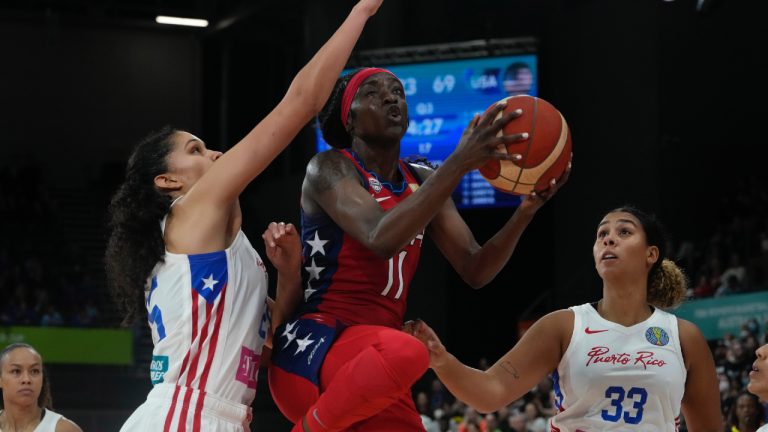 United States' Kahleah Copper tries to get the ball past Puerto Rico's players at the women's Basketball World Cup in Sydney, Australia, Friday, Sept. 23, 2022. (Mark Baker/AP)