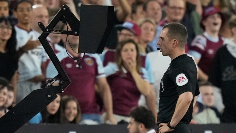 Referee checks the VAR monitor during the English Premier League soccer match between West Ham and Tottenham, at London Stadium, in London, Wednesday, Aug. 31, 2022. (Frank Augstein/AP)