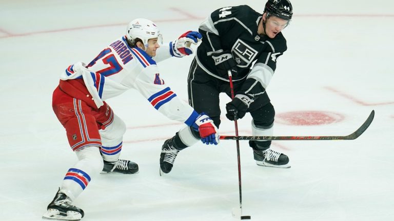 New York Rangers center Morgan Barron (47) defends against Los Angeles Kings defenseman Mikey Anderson (44) during the third period of an NHL hockey game Monday, Jan. 10, 2022, in Los Angeles. (Ashley Landis/AP)