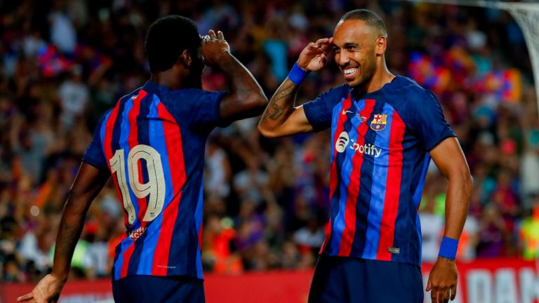 Barcelona's Pierre-Emerick Aubameyang, right, celebrates after scoring a goal with Barcelona's Franck Kessie during the Joan Gamper trophy soccer match between FC Barcelona and Pumas Unam at the Camp Nou Stadium in Barcelona, Spain, Sunday, Aug. 7, 2022. (Joan Monfort/AP)