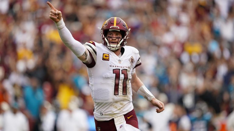 Washington Commanders quarterback Carson Wentz (11) reacting to making a two-point conversion against the Jacksonville Jaguars in the closing minutes of the second half of an NFL football game, Sunday, Sept. 11, 2022, in Landover, Md. (Patrick Semansky/AP)