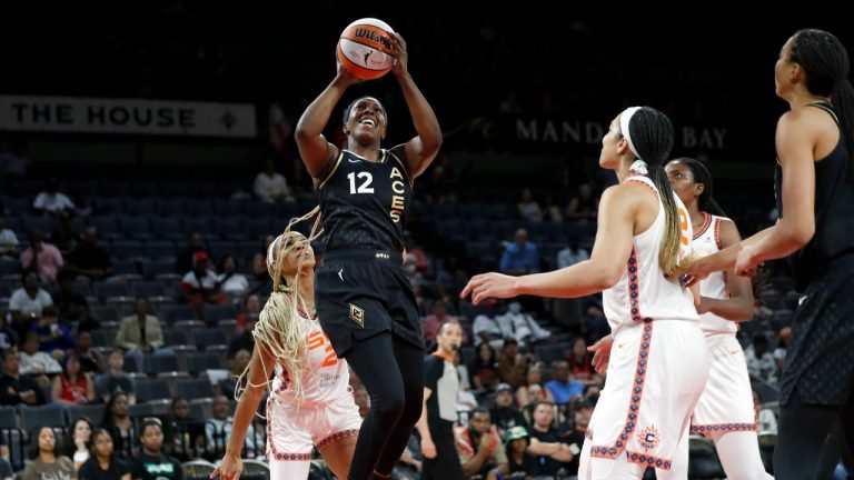 Las Vegas Aces guard Chelsea Gray (12) shoots against the Connecticut Sun during a WNBA basketball game in Las Vegas on Thursday, June 2, 2022. (Steve Marcus/Las Vegas Sun via AP)