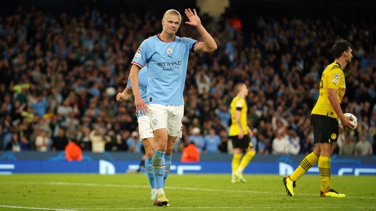 Manchester City's Erling Haaland, left, celebrates after scoring his side's 2nd goal during the group G Champions League soccer match between Manchester City and Borussia Dortmund. (Dave Thompson/AP)