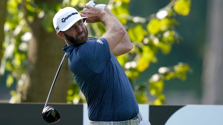 Dustin Johnson watches his tee shot on the 12th hole during the first round of the LIV Golf Invitational-Chicago tournament Friday, Sept. 16, 2022, in Sugar Grove, Ill. (Charles Rex Arbogast/AP)