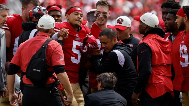 San Francisco 49ers quarterback Trey Lance (5) is helped onto a cart during the first half of an NFL football game against the Seattle Seahawks in Santa Clara, Calif., Sunday, Sept. 18, 2022. (Josie Lepe/AP)