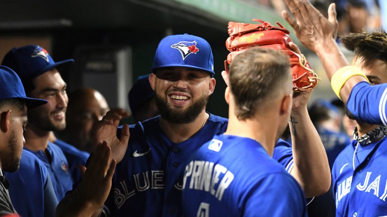 Toronto Blue Jays starter Alek Manoah, center, is greeted in the dugout after being pulled during the eighth inning of a baseball game against the Pittsburgh Pirates, Friday, Sept. 2, 2022, in Pittsburgh. (Philip G. Pavely/AP)