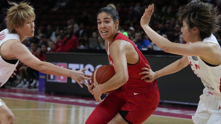 Canada's Kia Nurse attempts to get past the Japan defense during their game at the women's Basketball World Cup in Sydney. (Mark Baker/AP)