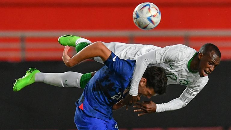 United States' Gio Reyna, bottom, duels for the ball with Saudi Arabia's Saud Abdullah Abdulhamid during the international friendly soccer match between Saudi Arabia and United States in Murcia, Spain, Tuesday, Sept. 27, 2022. (Jose Breton/AP) 