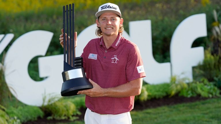 Cameron Smith poses with the champion's trophy after winning the LIV Golf Invitational-Chicago tournament Sunday, Sept. 18, 2022, in Sugar Hill, Ill. (Charles Rex Arbogast/AP)