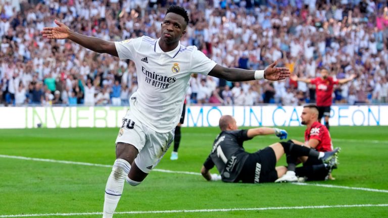 Real Madrid's Vinicius Junior, right, celebrates after scoring his side's 2nd goal during the Spanish La Liga soccer match between Real Madrid and Mallorca at the Santiago Bernabeu stadium in Madrid, Spain, Sunday, Sept. 11, 2022. (Manu Fernandez/AP)