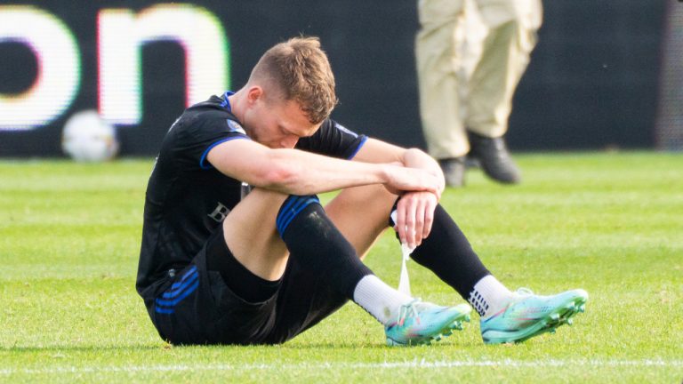 CF Montreal defender Alistair Johnston sits on the pitch after losing to the New York City FC during the Eastern Conference semifinals MLS action in Montreal on Sunday, October 23, 2022. (Paul Chiasson/CP)