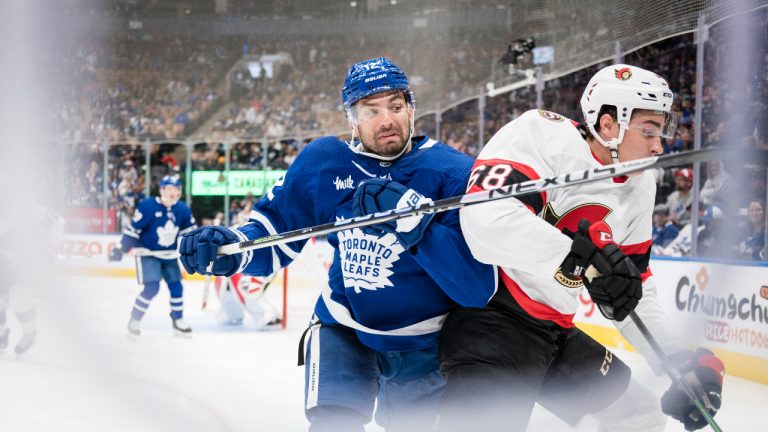 Toronto Maple Leafs forward Zach Aston-Reese (12) checks Ottawa Senators defenceman Kristians Rubins (68) during second period NHL pre-season action in Toronto on Saturday, September 24, 2022. (Christopher Katsarov/CP)