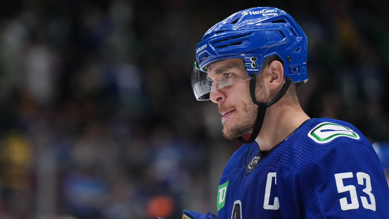 Canucks' J.T. Miller reacts to fans throwing jerseys