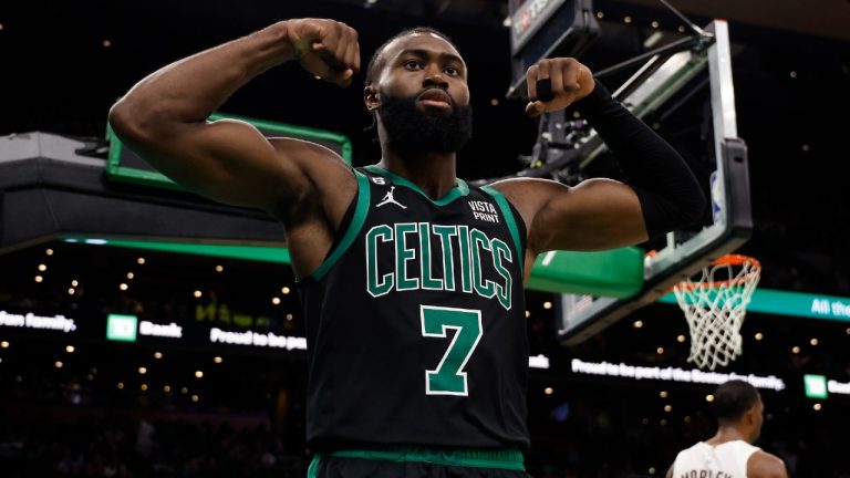 Boston Celtics' Jaylen Brown flexes his muscles after dunking during the second half of an NBA basketball game against the Cleveland Cavaliers Friday, Oct. 28, 2022, in Boston. (Winslow Townson/AP)