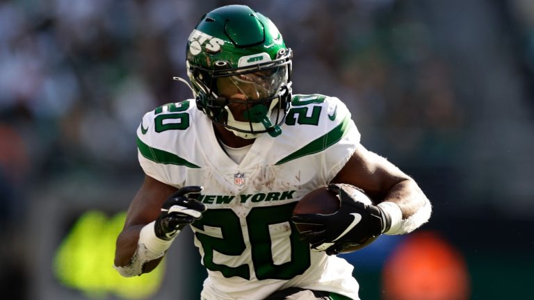 New York Jets running back Breece Hall (20) carries the ball against the Miami Dolphins during the fourth quarter of an NFL football game, Sunday, Oct. 9, 2022, in East Rutherford, N.J. (Adam Hunger/AP)