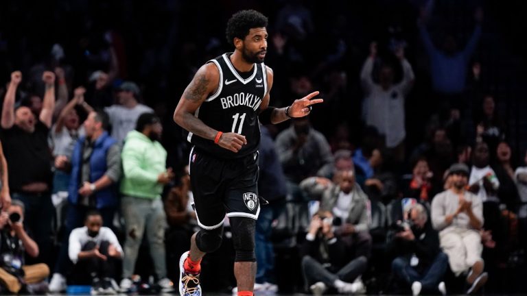 Brooklyn Nets' Kyrie Irving reacts after hitting a basket against the Cleveland Cavaliers during the first half of the opening basketball game of the NBA play-in tournament Tuesday, April 12, 2022, in New York. (Seth Wenig/AP)