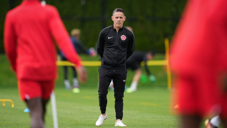 Canadian national men's soccer team head coach John Herdman watches a training session for a CONCACAF Nations League match against Curacao, in Vancouver, on Tuesday, June 7, 2022. (CP)