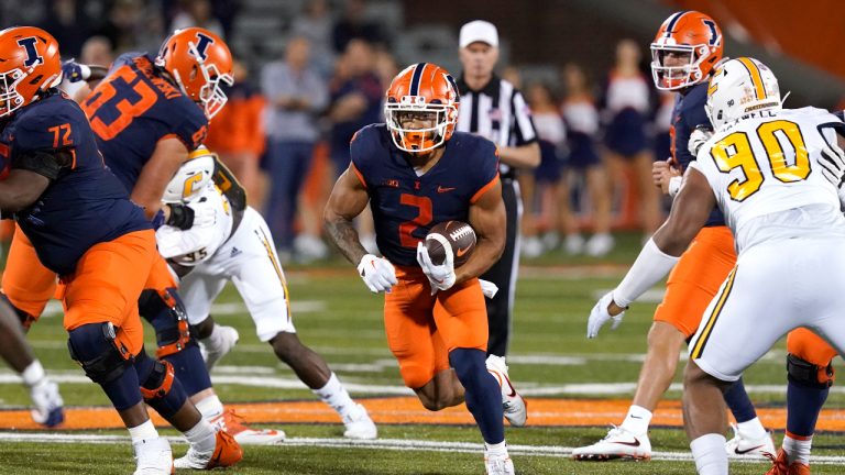 Illinois running back Chase Brown breaks into the open during the first half of the team's NCAA college football game against Chattanooga. (Charles Rex Arbogast/AP)