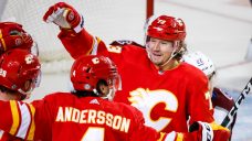 Flames hold off Avalanche, win season opener for first time since 2009